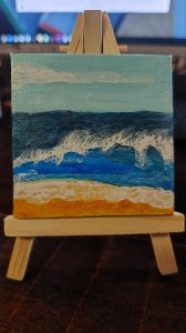 Ola rompiendo en la orilla