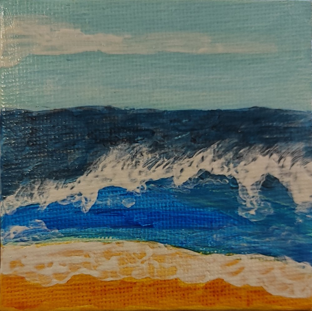 Ola rompiendo en la orilla