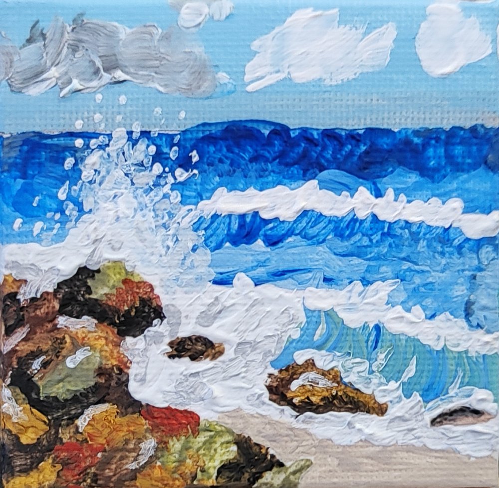 Olas rompiendo sobre rocas